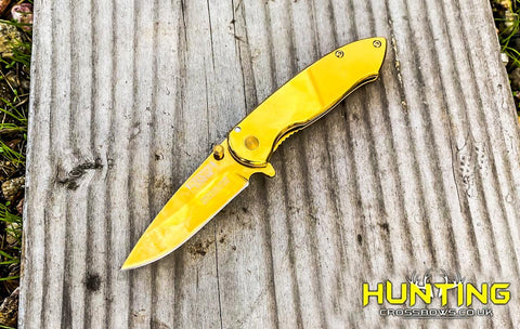 6.5" Defender-Xtreme Spring Assisted Gold Colored Tactical Knife with Belt Clip